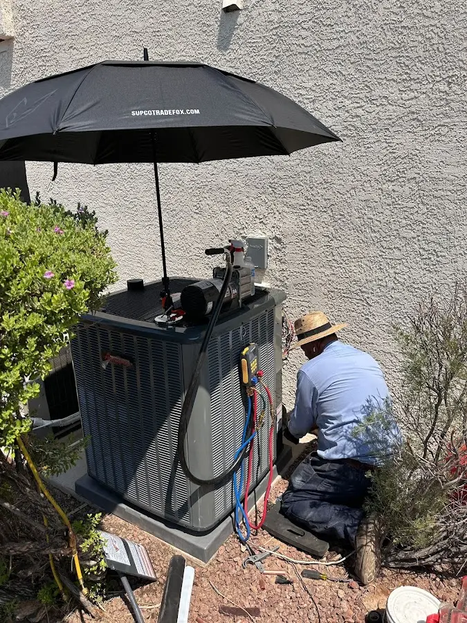 HVAC technician performing outdoor AC maintenance in New Hempstead